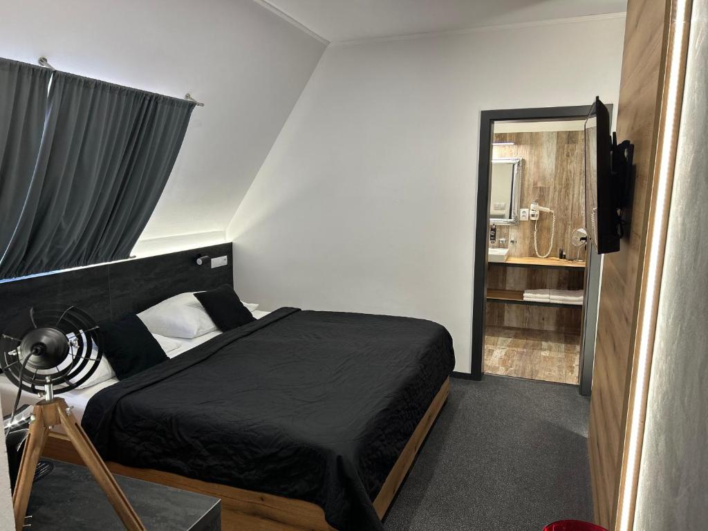 Postel nebo postele na pokoji v ubytování Hotel 14Dveří
