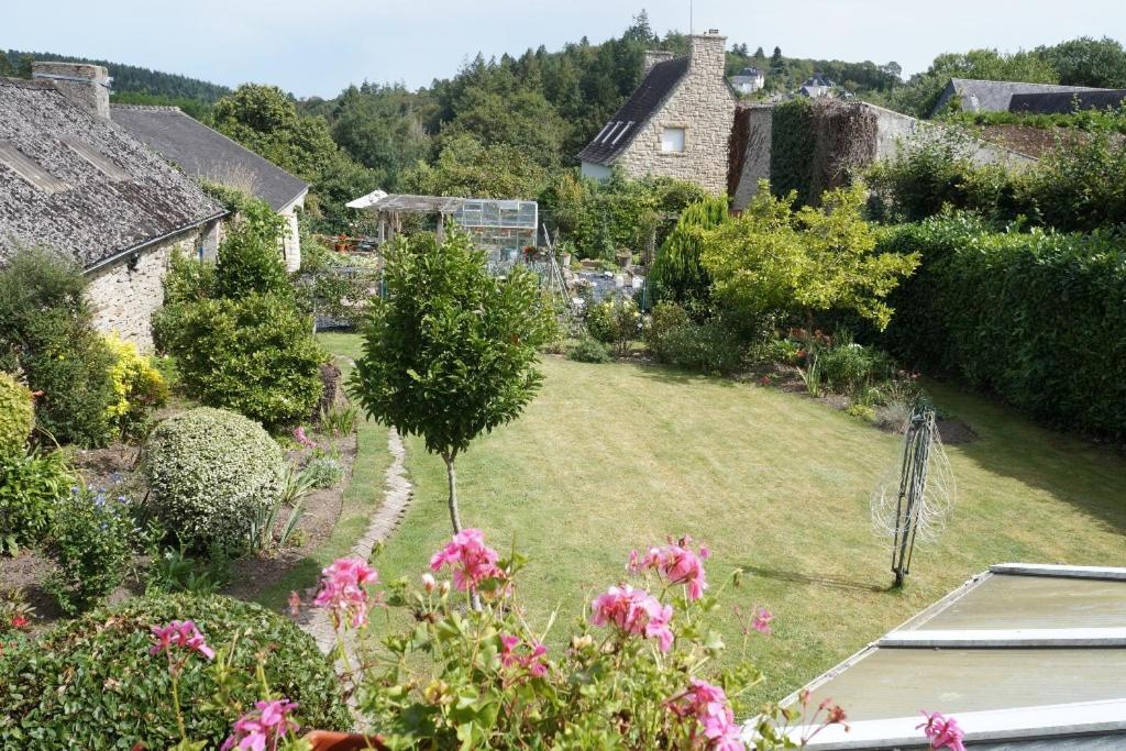 an aerial view of a garden with pink flowers at Rose Cottage in Huelgoat