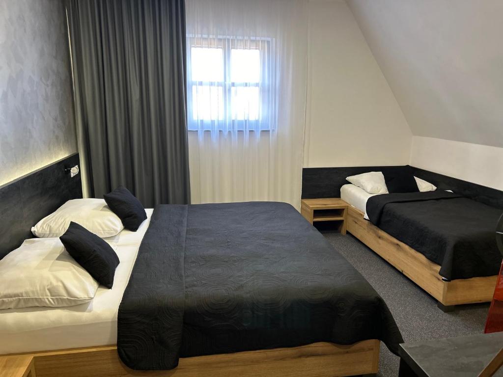 Postel nebo postele na pokoji v ubytování Hotel 14Dveří