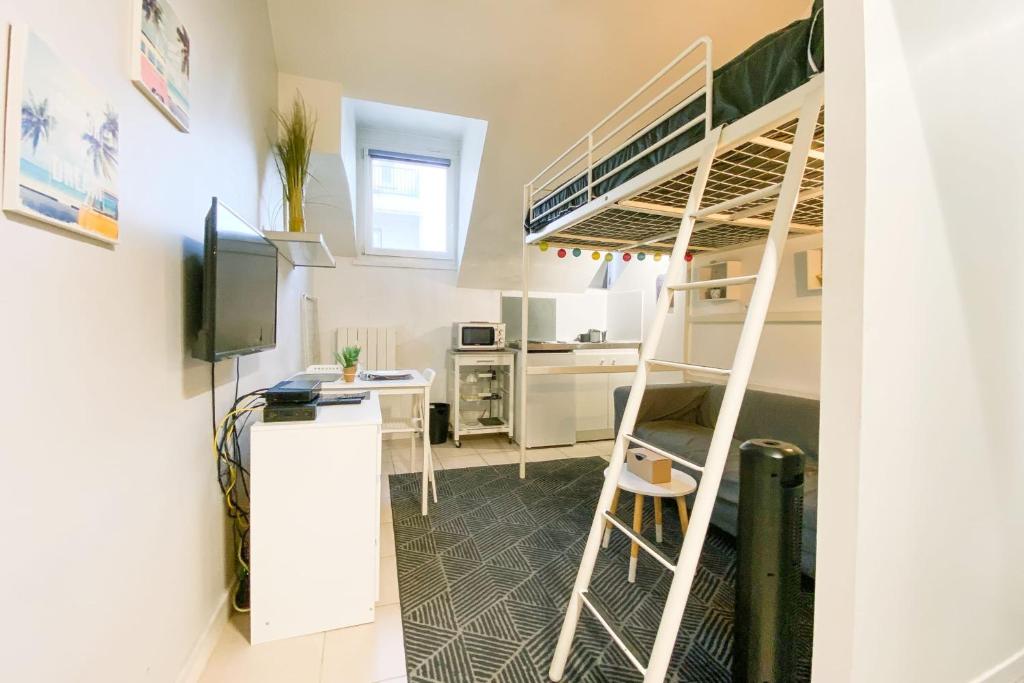 a small room with a bunk bed and a desk at The Champo studio Near the city centre #B2 in Grenoble