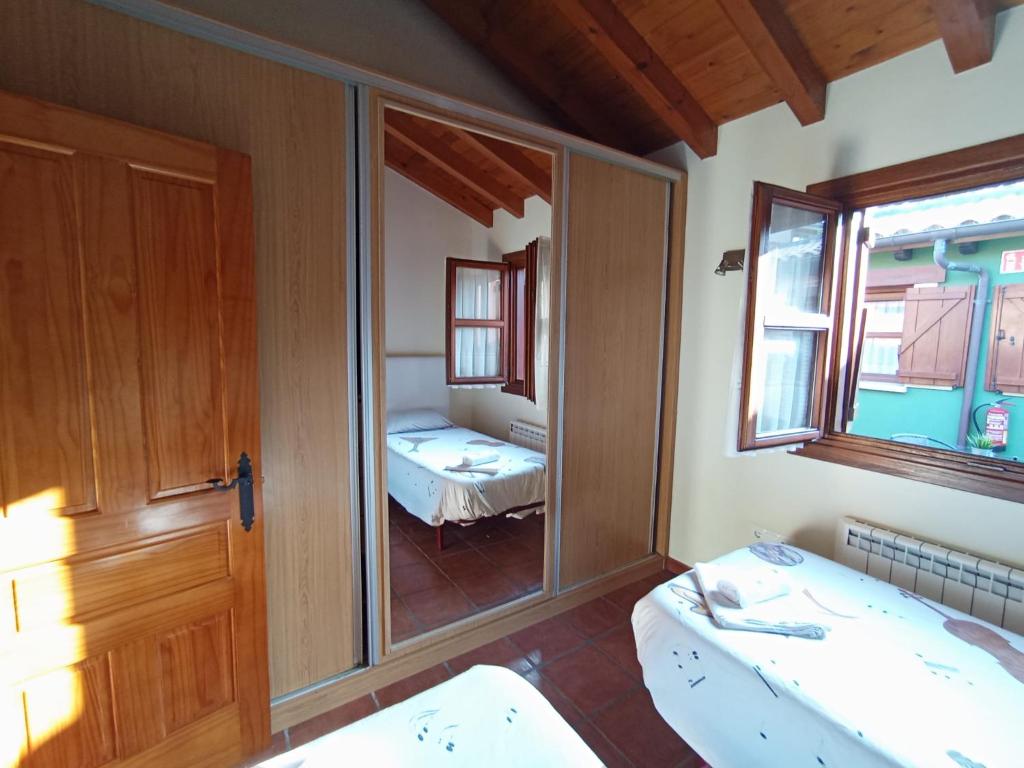 Cama o camas de una habitación en Apartamentos Las Cuadras de Estaños