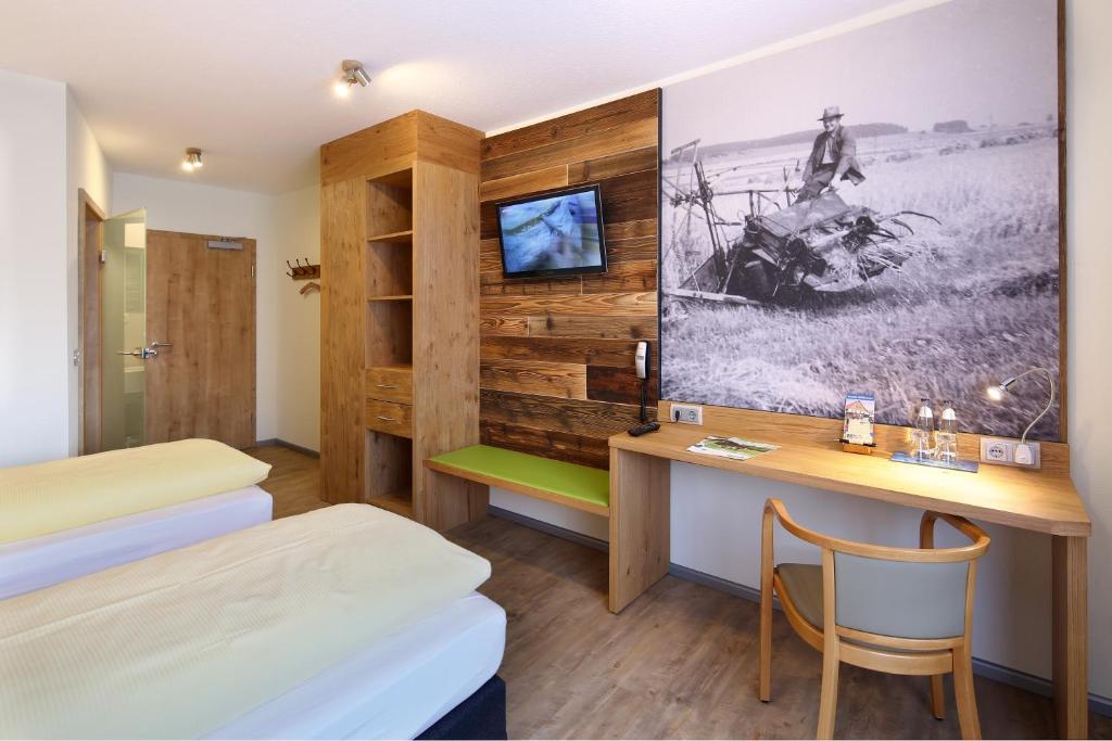 Postel nebo postele na pokoji v ubytování Landgasthof Kaiser