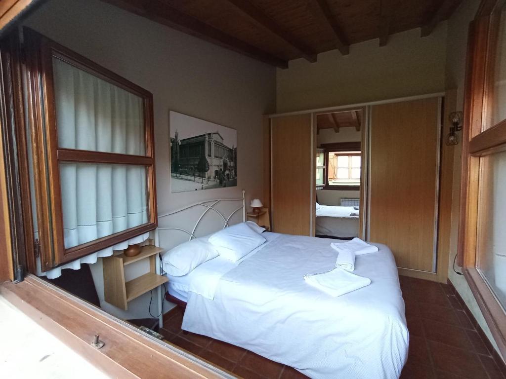 Cama o camas de una habitación en Apartamentos Las Cuadras de Estaños