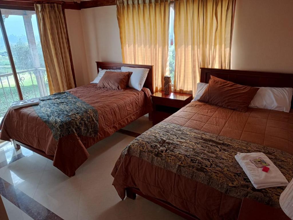 Ένα ή περισσότερα κρεβάτια σε δωμάτιο στο HOTELERIA CASA MAYA