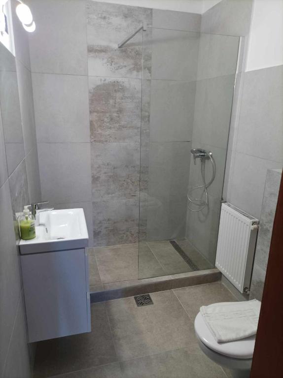 Koupelna v ubytování HELIOS Hotel Apartments