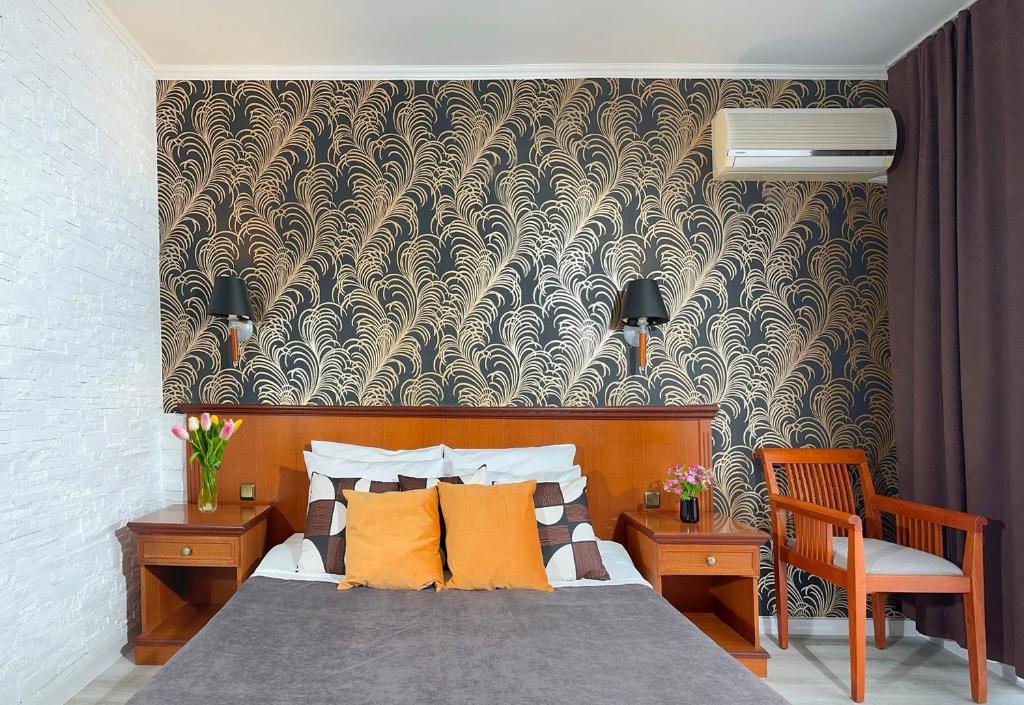 a bedroom with a bed and a wall mural at Hotel Yo in St. St. Constantine and Helena