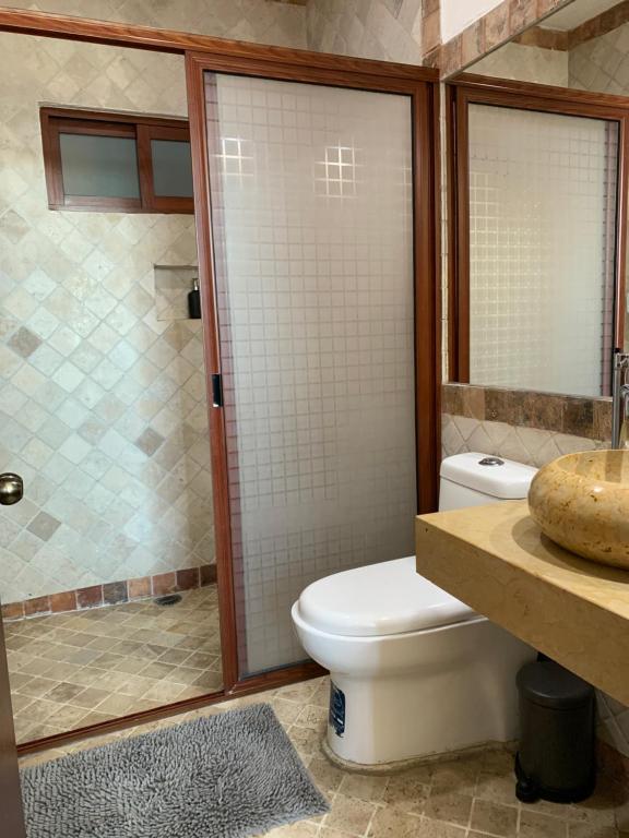 Koupelna v ubytování CHOLULA SUITES