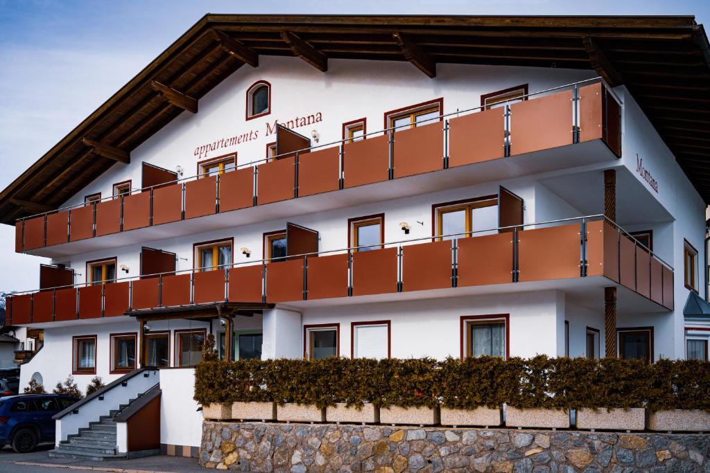 a building with balconies on the side of it at Residence Montana in Resia