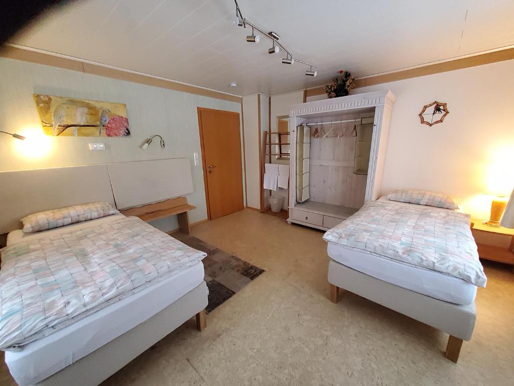 Postel nebo postele na pokoji v ubytování B & B Gästehaus Schmidt