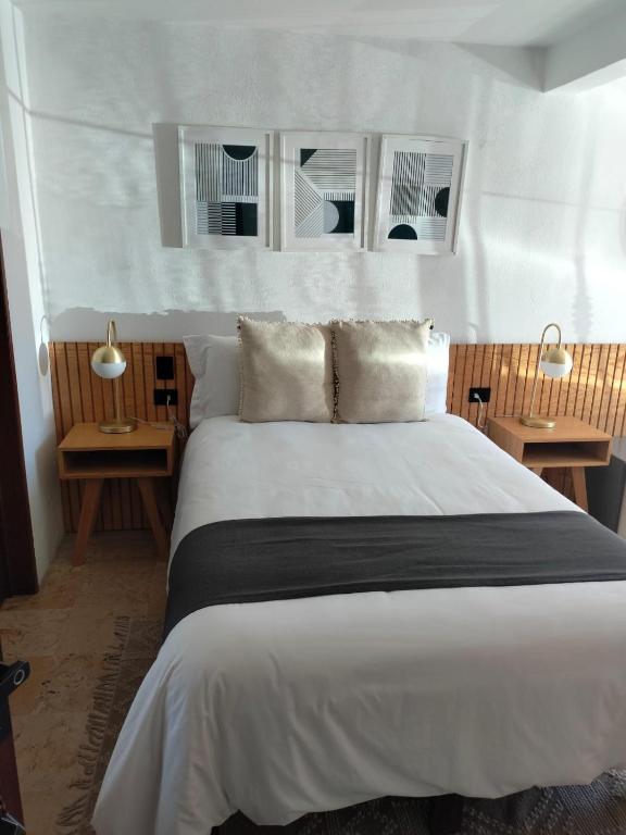 Postel nebo postele na pokoji v ubytování CHOLULA SUITES