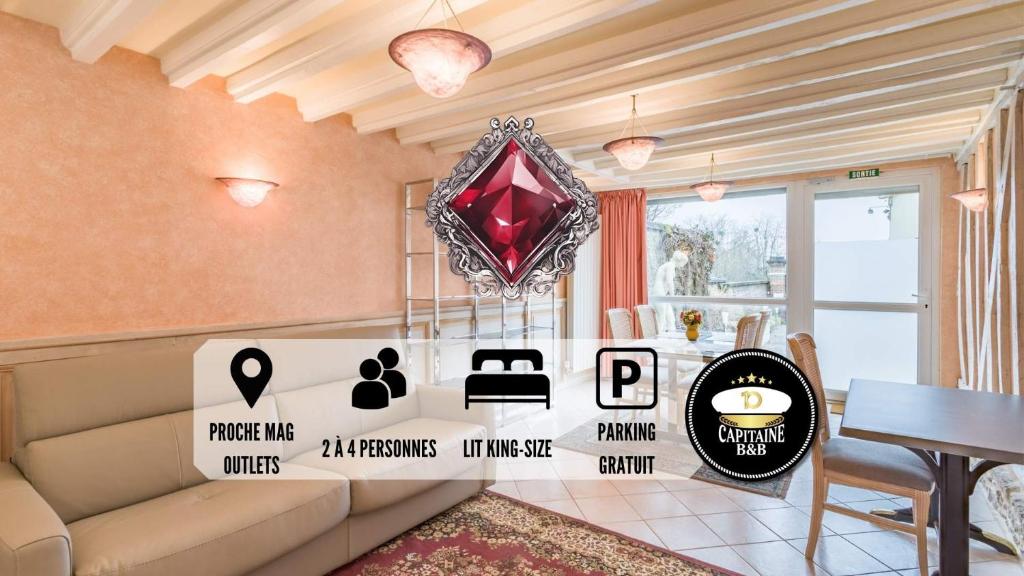 un soggiorno con divano e diamante rosso di Le RUBIS - Confort - Proche Mag Outlet Troyes - Parking gratuit a Pont-Sainte-Marie