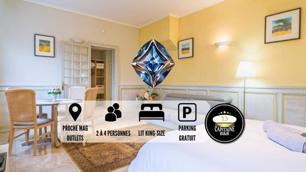 ポン・サント・メリーにあるLe SAPHIR - Confort - Proche Mag Outlet Troyes - Parking gratuitのベッド1台とテーブルが備わる部屋
