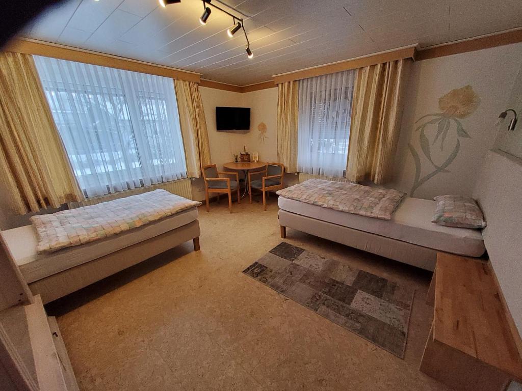 Postel nebo postele na pokoji v ubytování B & B Gästehaus Schmidt