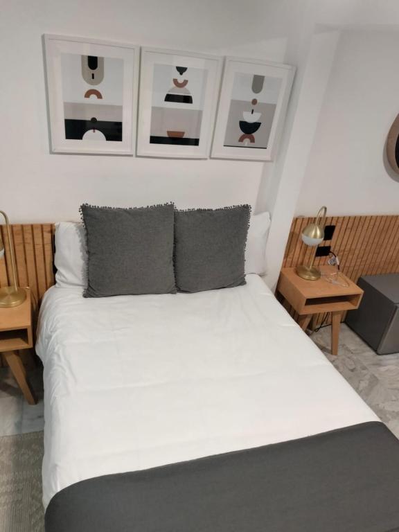Postel nebo postele na pokoji v ubytování CHOLULA SUITES