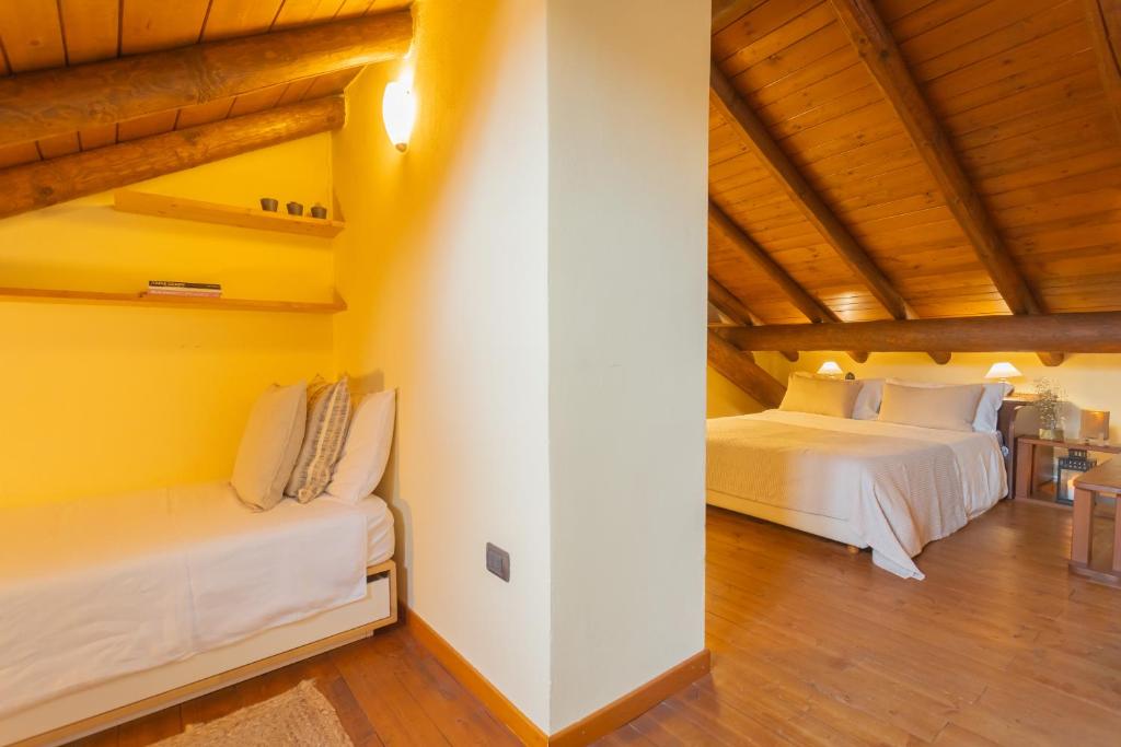 Posteľ alebo postele v izbe v ubytovaní Casa Giovio Elengant loft in historical building