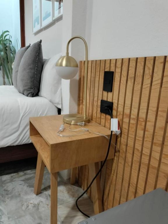 Postel nebo postele na pokoji v ubytování CHOLULA SUITES