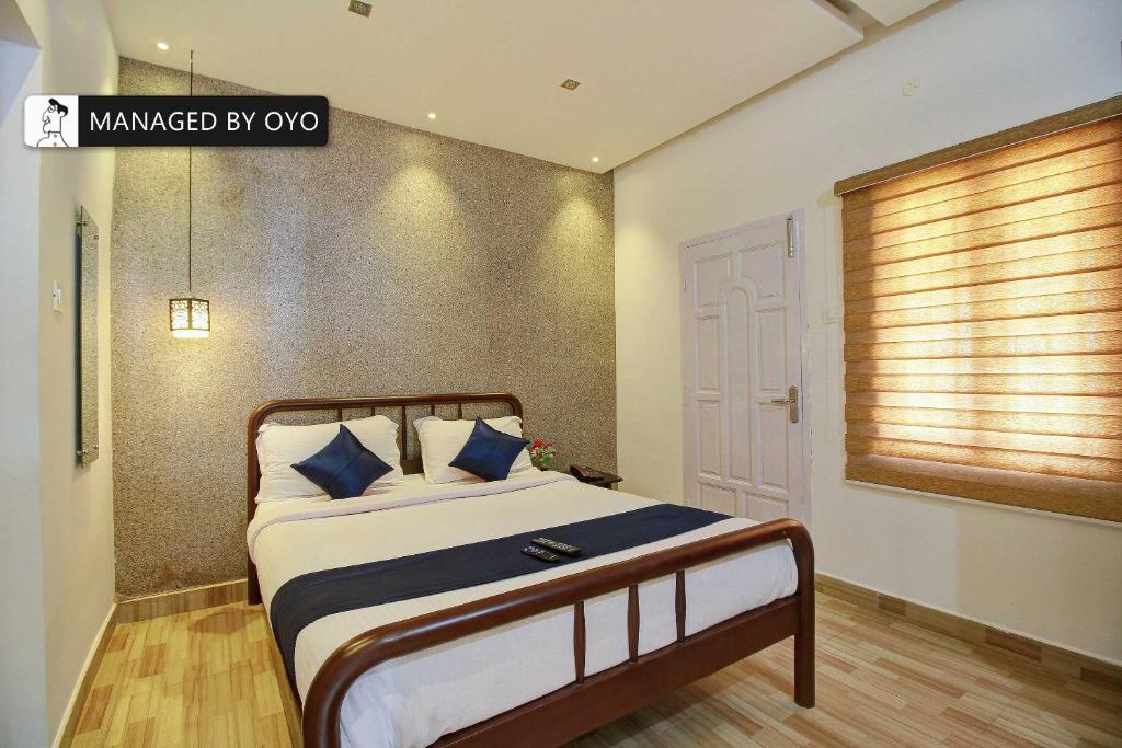 Ένα ή περισσότερα κρεβάτια σε δωμάτιο στο Super Collection O Kodai Mist Perumpallam - Managed by Company