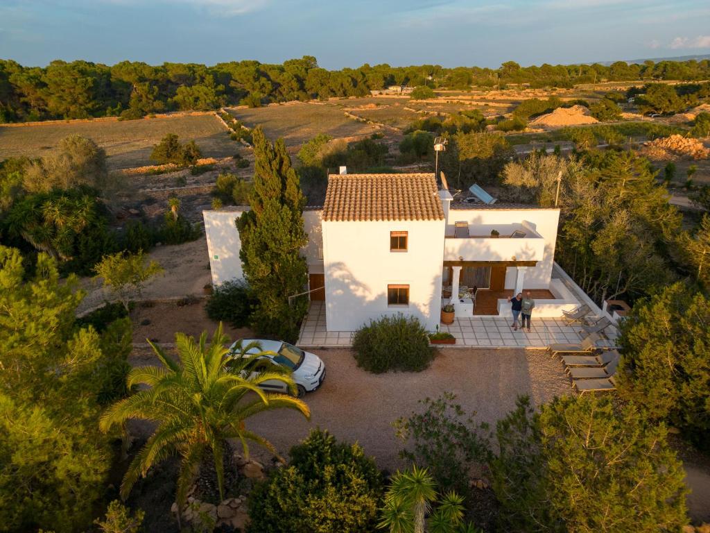 an overhead view of a white house in a field at Ses Oliveres in Cala Saona