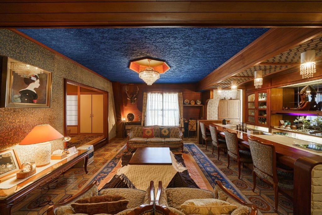 a living room with a couch and a table at Oyado Tonbo - Vacation STAY 16107 in Kaga
