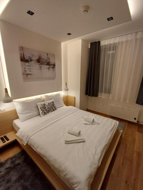 Postel nebo postele na pokoji v ubytování Apart Hotel Zlatni Javor, Apartment 410