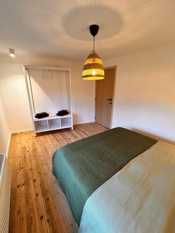 Postel nebo postele na pokoji v ubytování Gîte urbain L'Oneux