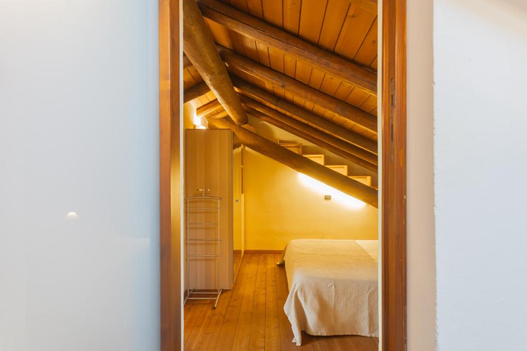 Posteľ alebo postele v izbe v ubytovaní Casa Giovio Elengant loft in historical building