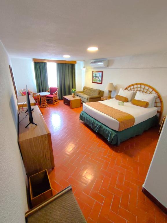 Postel nebo postele na pokoji v ubytování Hotel Chicala