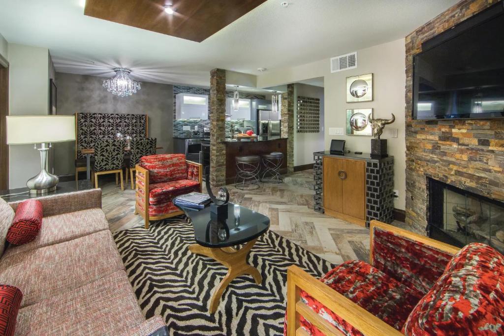 a living room with a couch and a fireplace at Holiday Inn Club Vacations at Desert Club Resorts in Las Vegas