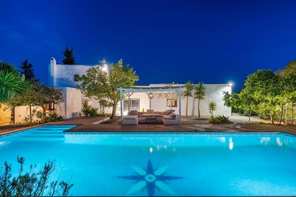 a large swimming pool in front of a house at 8 Guests Large Villa near Bossa Beaches & Airport in Sant Josep de Sa Talaia