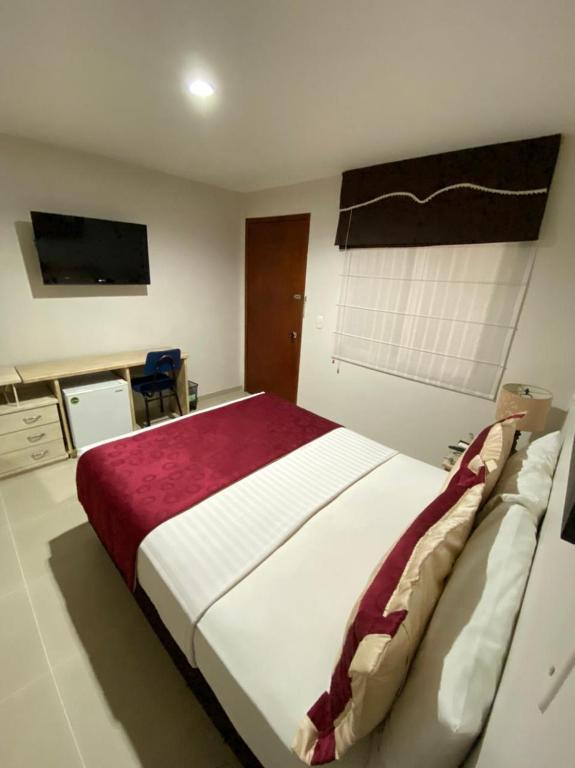 Postel nebo postele na pokoji v ubytování Cabecera Country Hotel