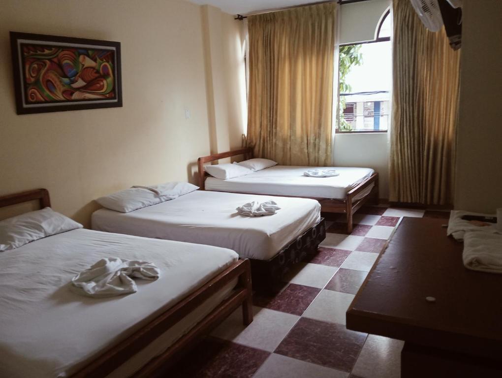 Giường trong phòng chung tại Hotel damayu