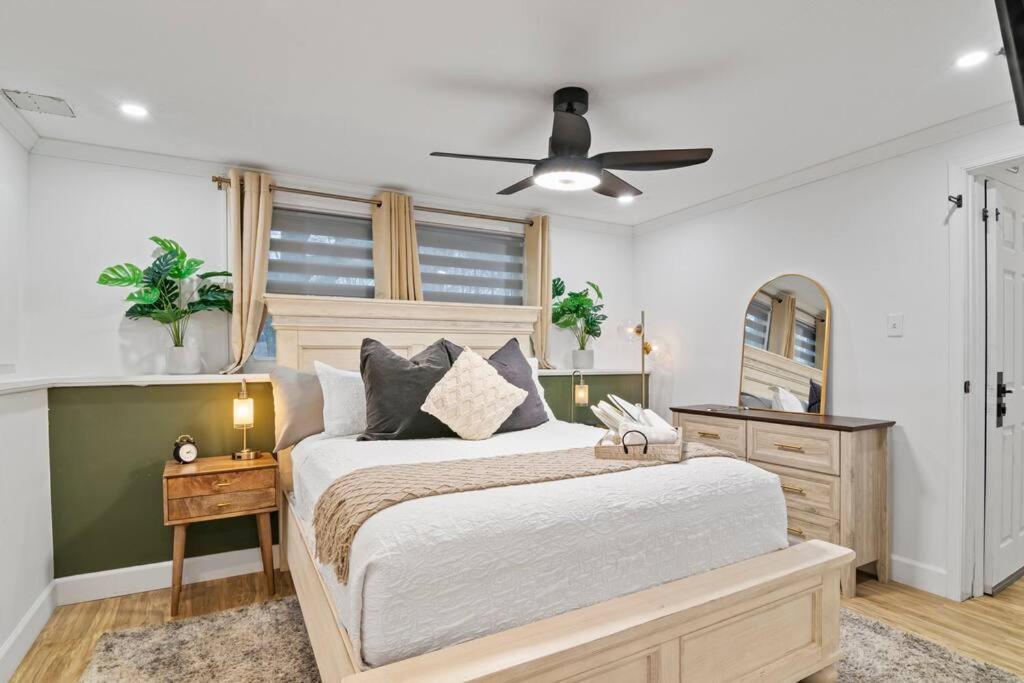 a bedroom with a bed and a ceiling fan at Maryland’s Pulse Southern Retreat in Waldorf