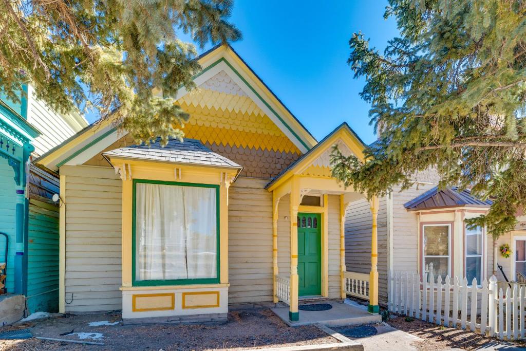 a house with yellow and green trim at Close to Casinos and Trails Historic Victor Cottage in Victor