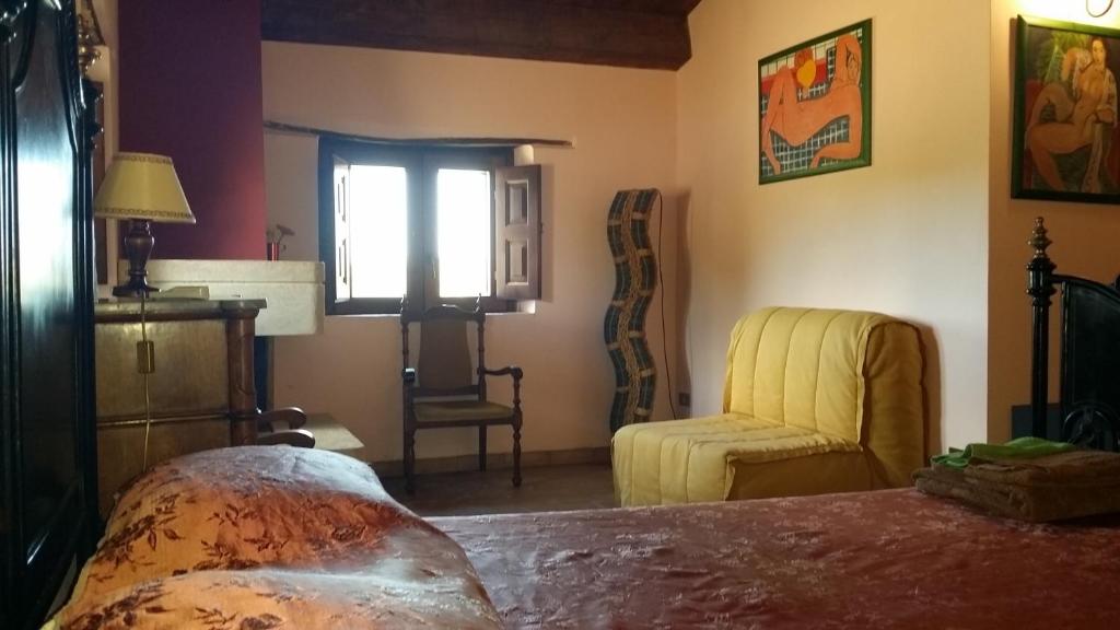 Łóżko lub łóżka w pokoju w obiekcie Agriturismo Malena