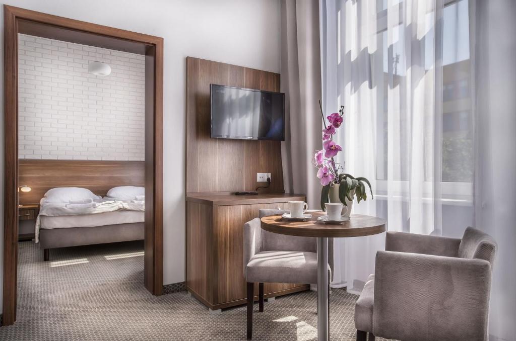 Postel nebo postele na pokoji v ubytování Admirał I