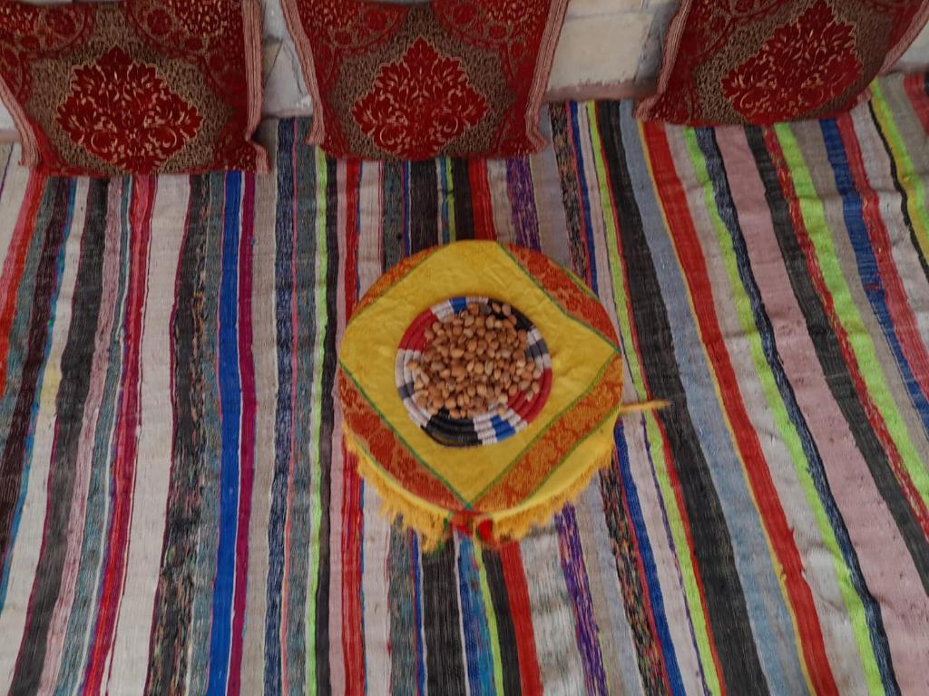 a close up of a bed with a plate of food on it at RISA FAMILY in Taroudant