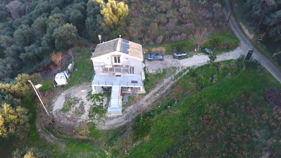 an aerial view of a house on a hill at FRUIT Echo Villa in Avliótai