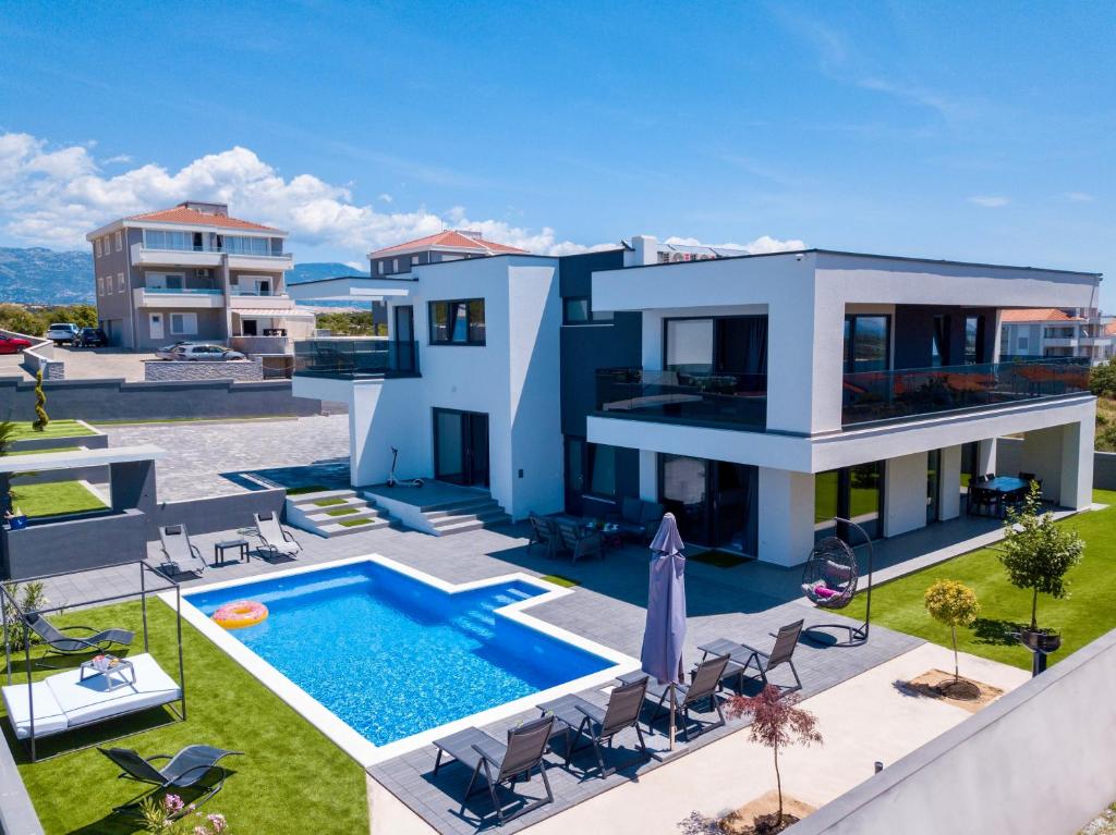 an aerial view of a house with a swimming pool at Fantasy Daydream Mansion in Novalja