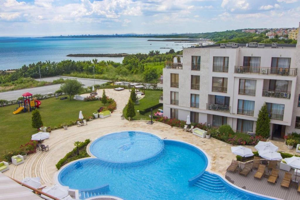 an aerial view of a resort with a swimming pool at Diamond Beach Apartment 2 Room in Burgas City