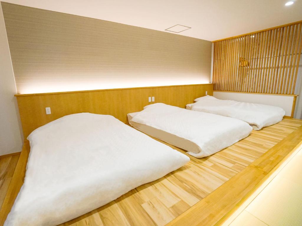 Postel nebo postele na pokoji v ubytování Hotel Abest Hakuba Resort