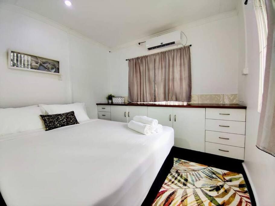 Postel nebo postele na pokoji v ubytování Guesthouse in Suva