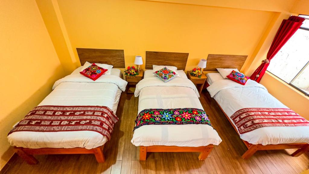 Postel nebo postele na pokoji v ubytování Andean Atoq Hostel