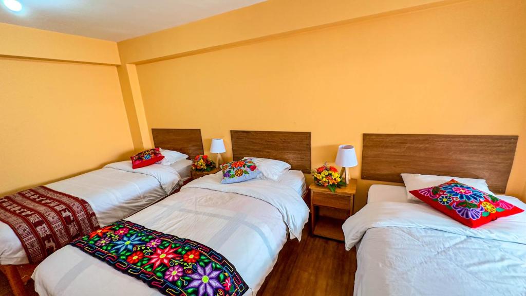 Postel nebo postele na pokoji v ubytování Andean Atoq Hostel