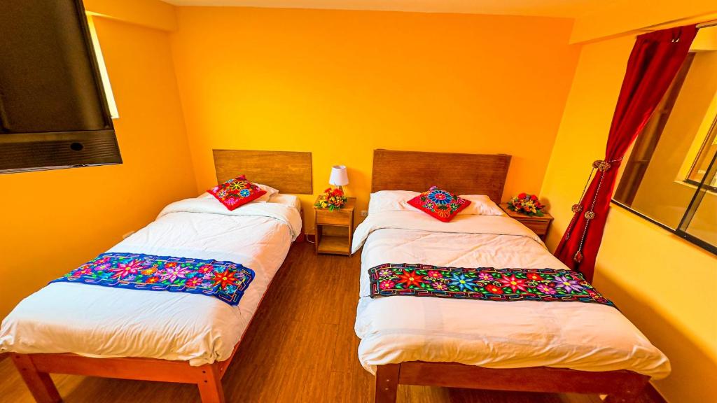 Postel nebo postele na pokoji v ubytování Andean Atoq Hostel