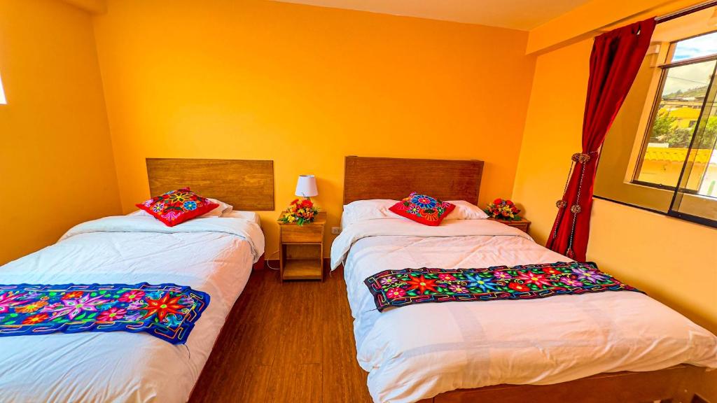 Postel nebo postele na pokoji v ubytování Andean Atoq Hostel