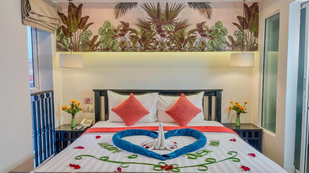 Postel nebo postele na pokoji v ubytování Dusit Hotel Siem Reap