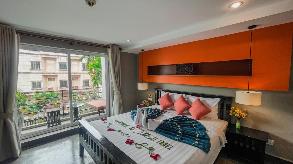 Postel nebo postele na pokoji v ubytování Dusit Hotel Siem Reap