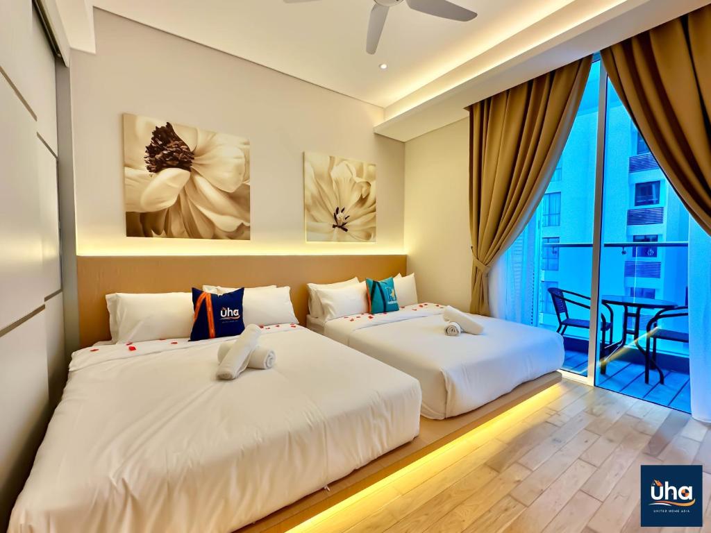 Katil atau katil-katil dalam bilik di PineTree Puteri Harbour by RR JBcity