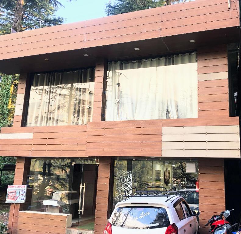 a car parked in front of a building at Rana's House, Mcleodganj in McLeod Ganj