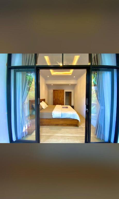 Ein Bett oder Betten in einem Zimmer der Unterkunft Homestay Nang Taro